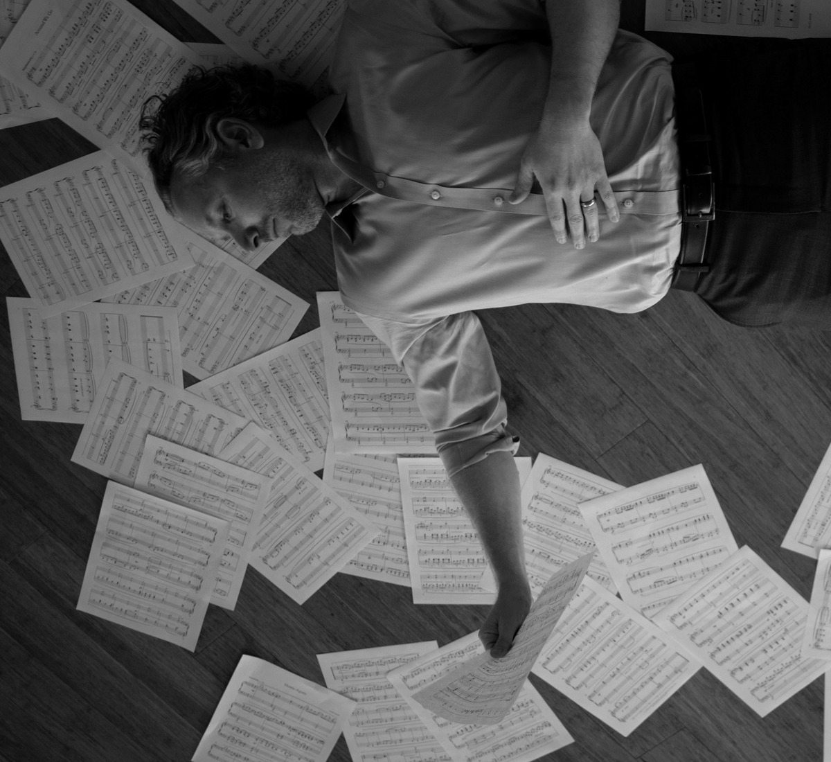 Justin Levitt surrounded by sheet music
